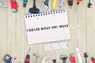 Create what you want against tools and notepad on wooden backgro