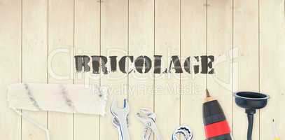 Bricolage against diy tools on wooden background