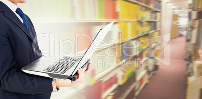 Composite image of businessman with watch using tablet pc Composite image of businessman with watch using tablet pc