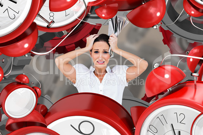 Composite image of worried stylish businesswoman holding newspap