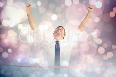 Composite image of businessman crossing the finish line Composite image of businessman crossing the finish line