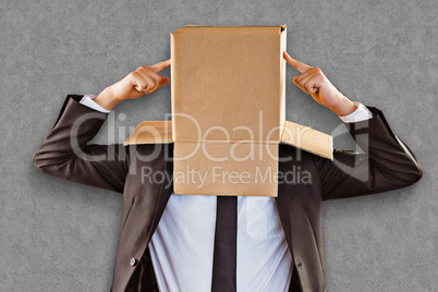 Composite image of anonymous businessman pointing to box