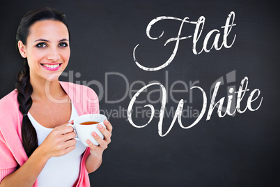 Composite image of pretty brunette holding a mug