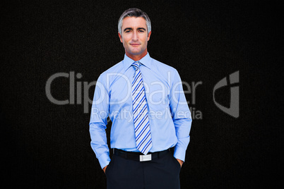 Composite image of smiling businessman in suit with hands in poc