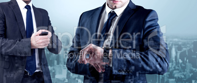 Composite image of focused businessman texting on his mobile pho