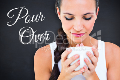 Composite image of pretty brunette having cup of tea