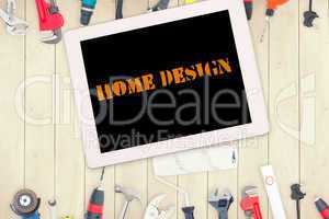 Home design against tools and tablet on wooden background