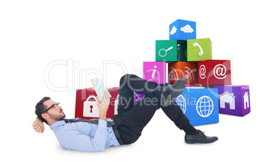 Composite image of businessman lying on the floor while reading