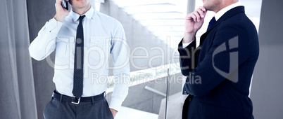 Composite image of elegant businessman in suit posing