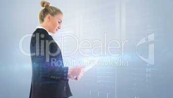 Composite image of businesswoman holding tablet