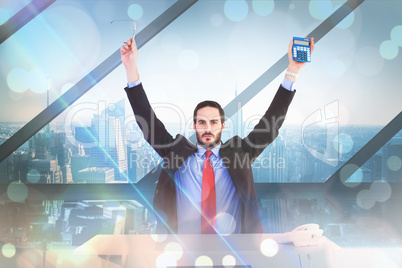 Composite image of businessman holding up reading glasses and ca