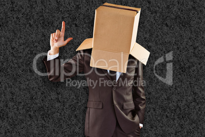 Composite image of anonymous businessman pointing up with finger