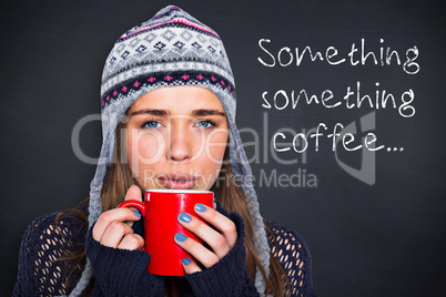 Composite image of beautiful woman in warm clothing drinking cof