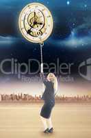 Composite image of businesswoman pulling a chain