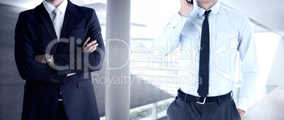 Composite image of businessman on the phone