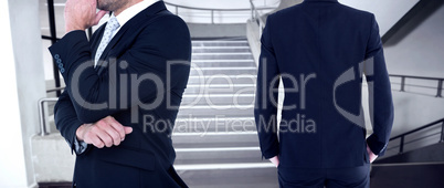 Composite image of rear view of handsome businessman