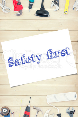 Safety first against tools on wooden background