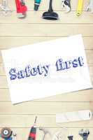 Safety first against tools on wooden background