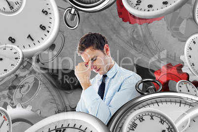 Composite image of businessman with a headache