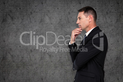 Composite image of businessman thinking