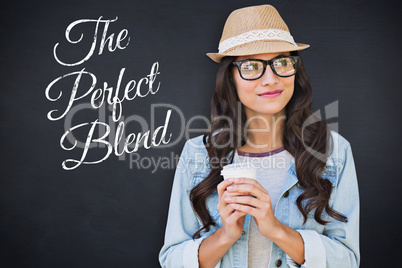 Composite image of brunette with disposable cup