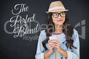 Composite image of brunette with disposable cup