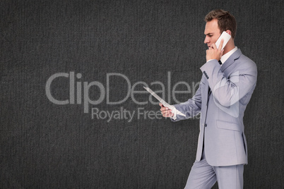 Composite image of businessman on the phone