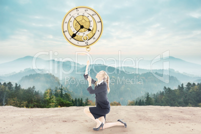 Composite image of businesswoman pulling a chain