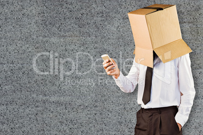 Composite image of anonymous businessman with his smartphone