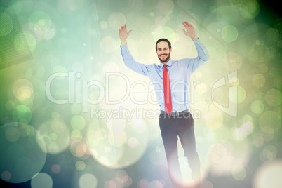 Composite image of smiling businessman stepping with hands raise