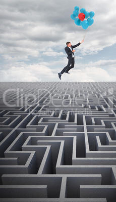 Composite image of businessman flying with balloon