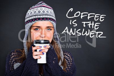 Composite image of beautiful woman in warm clothing drinking cof