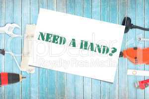 Need a hand? against diy tools on wooden background