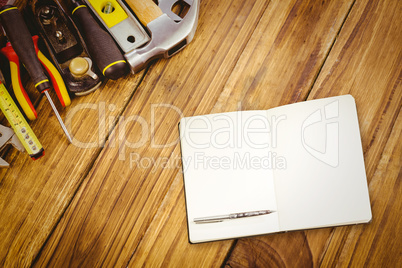 Composite image of notebook and pen