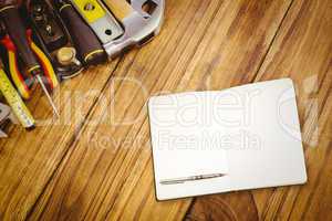 Composite image of notebook and pen