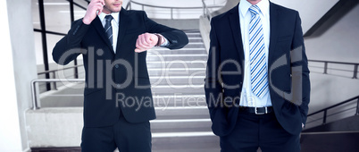 Composite image of smiling elegant businessman with hands in poc