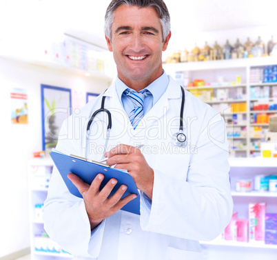 Composite image of happy doctor writing on clipboard