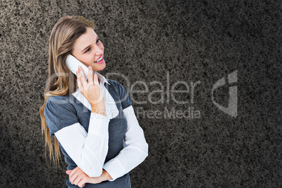 Composite image of happy blonde on the phone