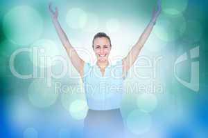 Composite image of businesswoman with arms raised