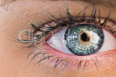 Composite image of close up of female blue eye