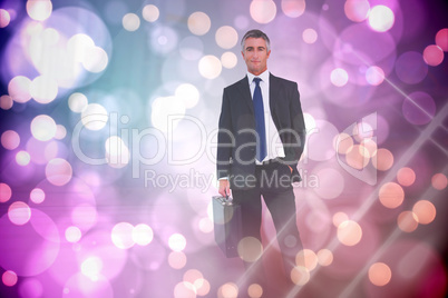 Composite image of businessman crossing finish line and cheering