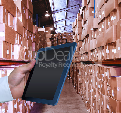 Composite image of man using tablet pc Composite image of man using tablet pc