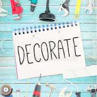 Decorate  against tools and notepad on wooden background