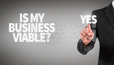 Composite image of businessman standing and pointing