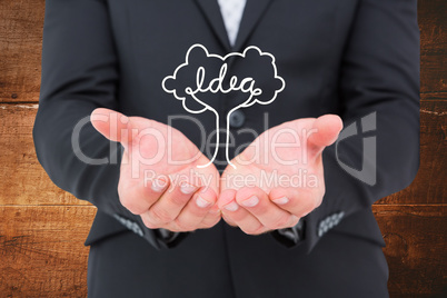 Composite image of businessman holding his hands out