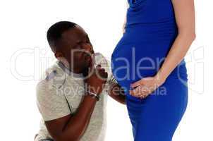 Black man wondering baby belly.