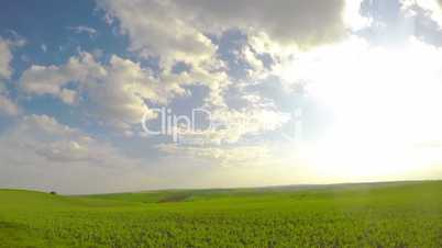 Sun and Clouds over Fields. Timelapse