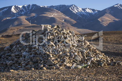 Pile of stones on a background of mountains
