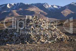 Pile of stones on a background of mountains