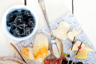 mix cold cut on a stone with fresh pears